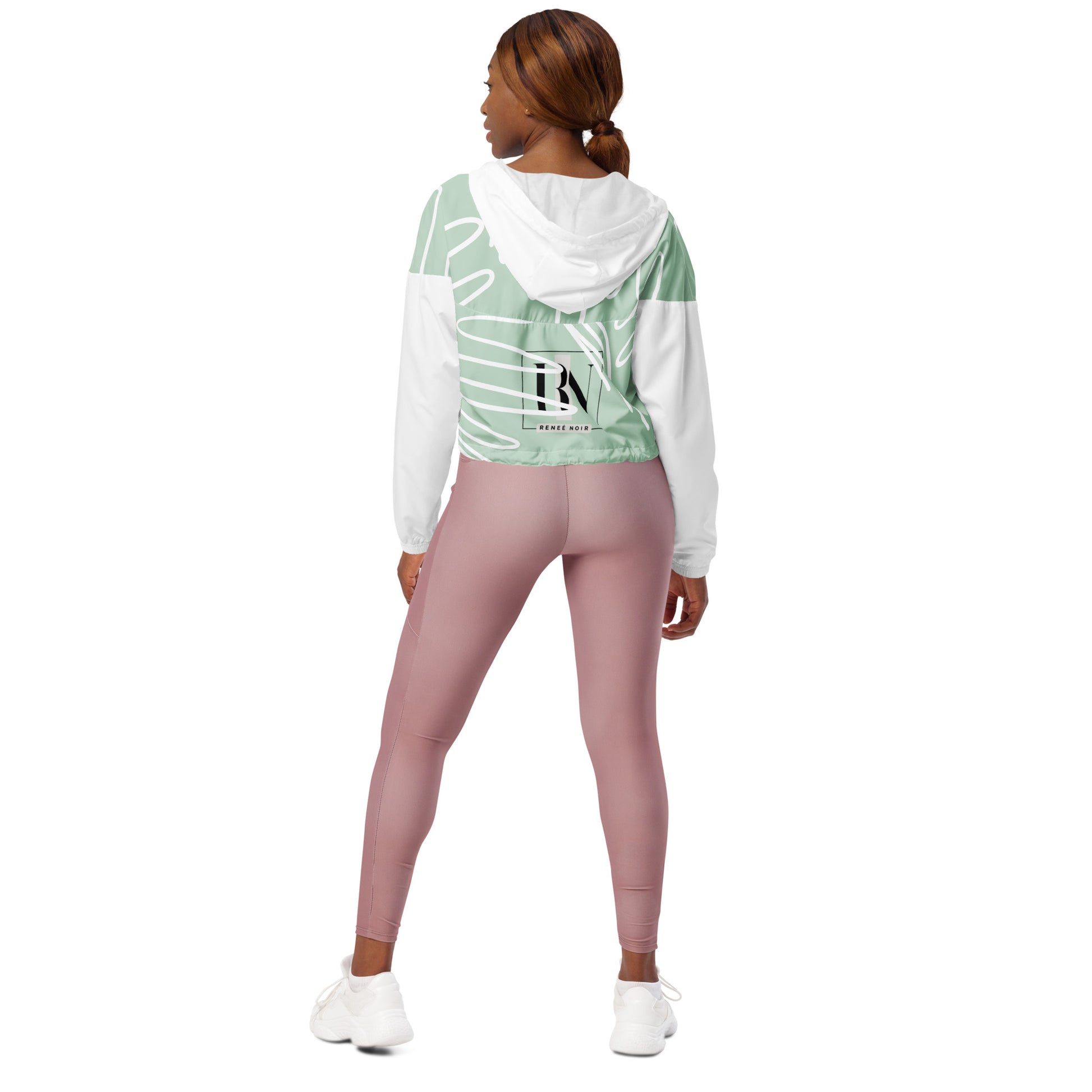 Women’s Cropped Windbreaker – back view showing adjustable hood and waist drawcords, Renee Noir mockup
